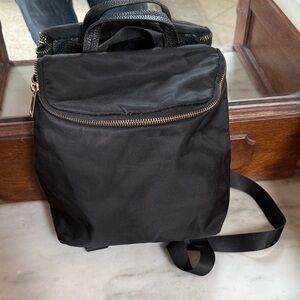 a new day Black Backpack with gold zipper